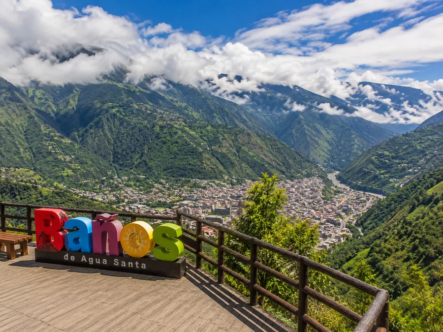 Scenic view of Baños de Agua Santa surrounded by mountains.